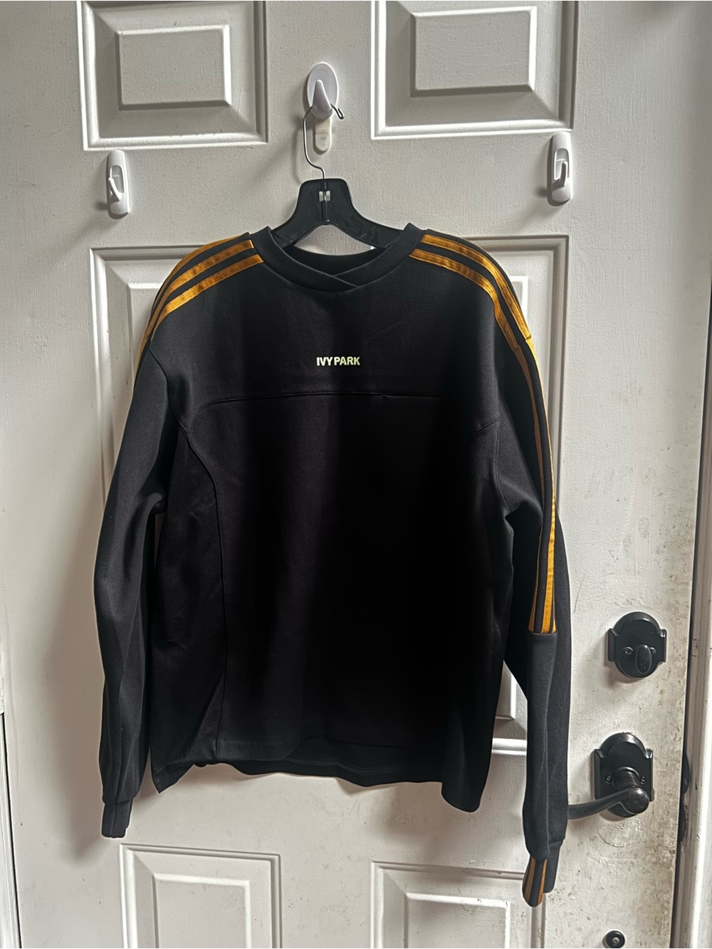 Adidas x IVY PARK Unisex Black Long Sleeves Crewneck Sweatshirt with Gold Stripe